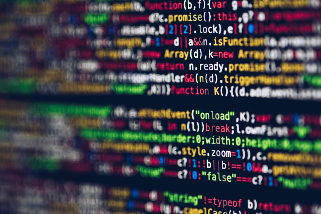 pexels-photo-2004161-2004161 Vivid, blurred close-up of colorful code on a screen, representing web development and programming.